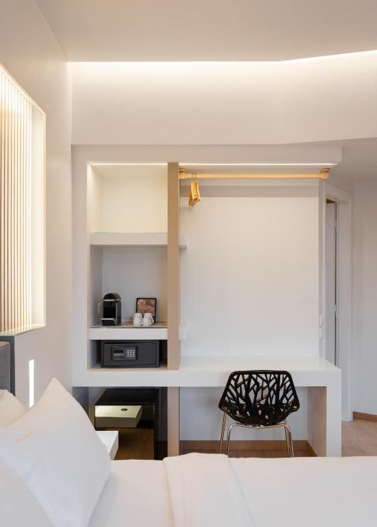 Postel nebo postele na pokoji v ubytování Kreoli Hotel