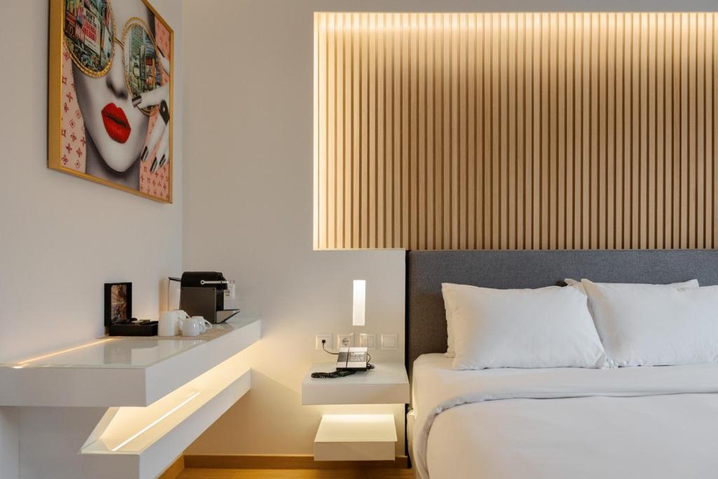 Postel nebo postele na pokoji v ubytování Kreoli Hotel