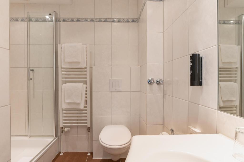 Koupelna v ubytování Hotel Commodore