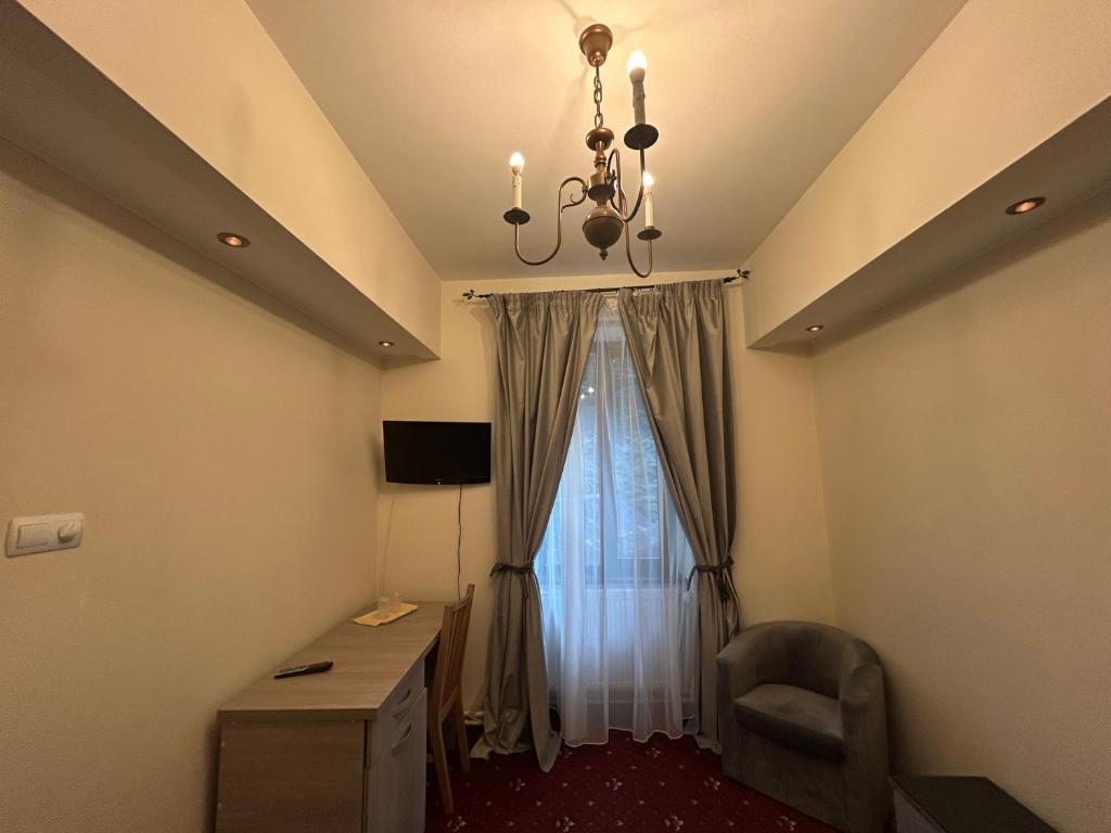 TV a/nebo společenská místnost v ubytování Hotel Stavilar