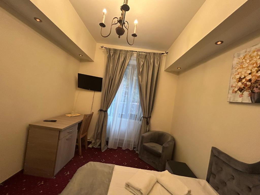 TV a/nebo společenská místnost v ubytování Hotel Stavilar