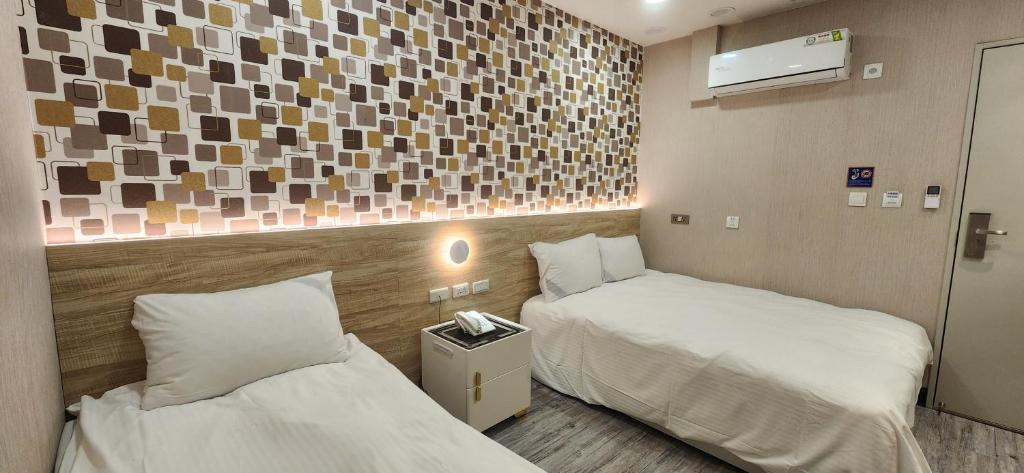 Postel nebo postele na pokoji v ubytování 成都壹壹壹商旅
