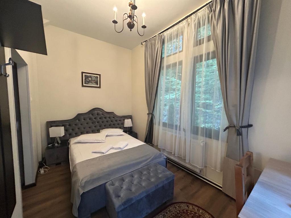 Postel nebo postele na pokoji v ubytování Hotel Stavilar