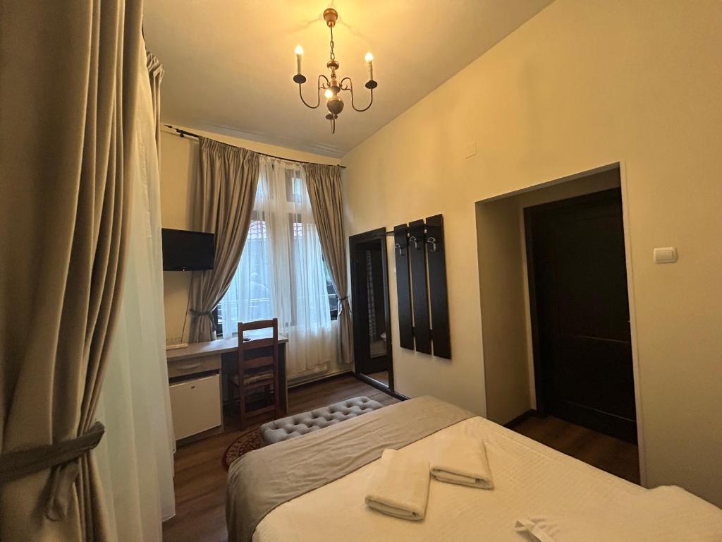 Postel nebo postele na pokoji v ubytování Hotel Stavilar