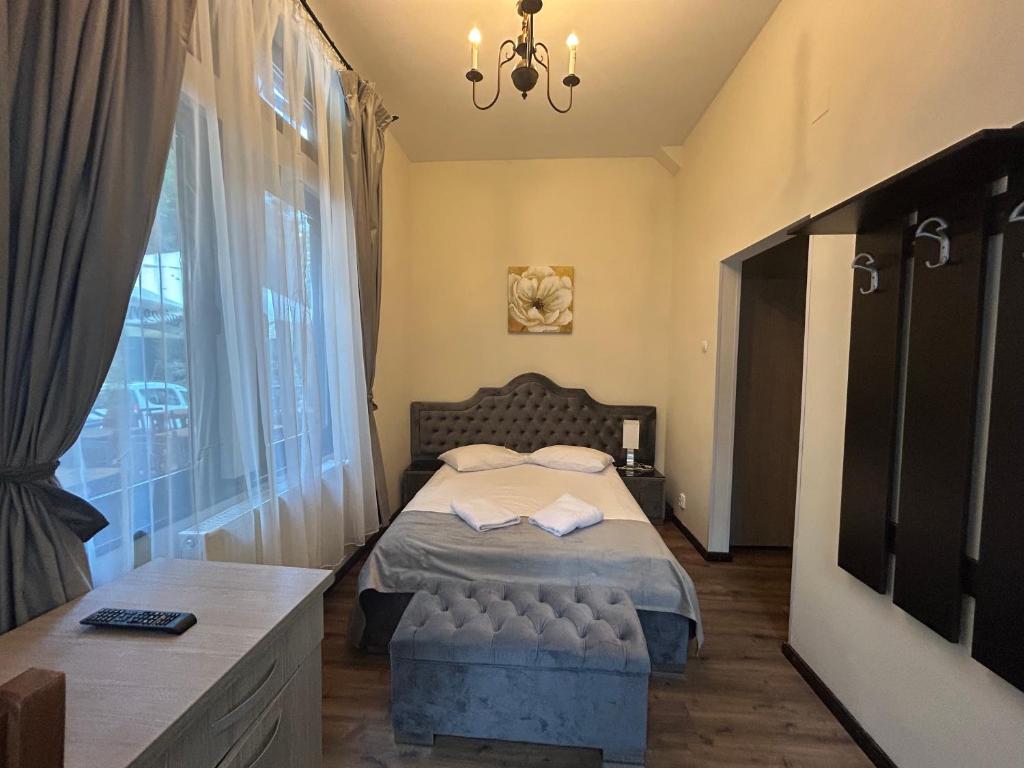 Postel nebo postele na pokoji v ubytování Hotel Stavilar
