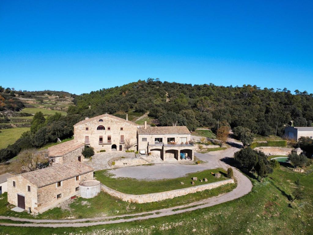 an aerial view of a house on a hill at Les Corts De Biosca in Castelltallat