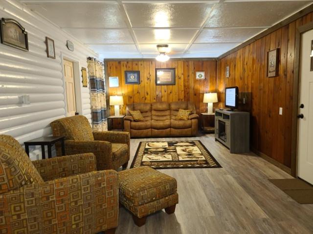 a living room with a couch and a tv in a room at Bayview Campgrounds in Hillsboro