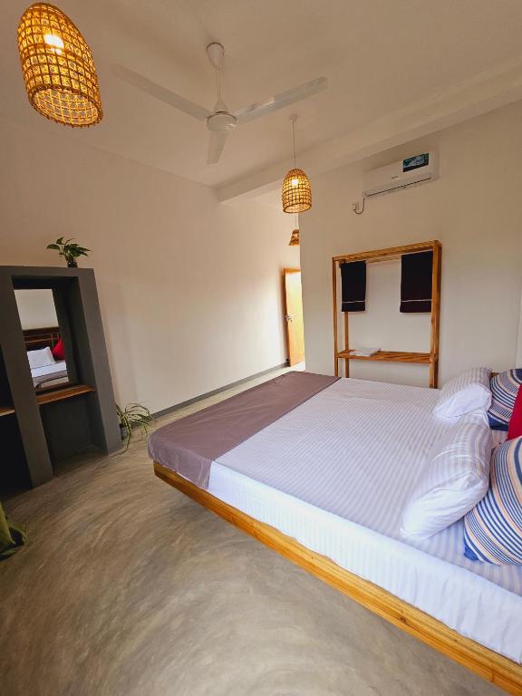Postel nebo postele na pokoji v ubytování Sun Rest Mirissa