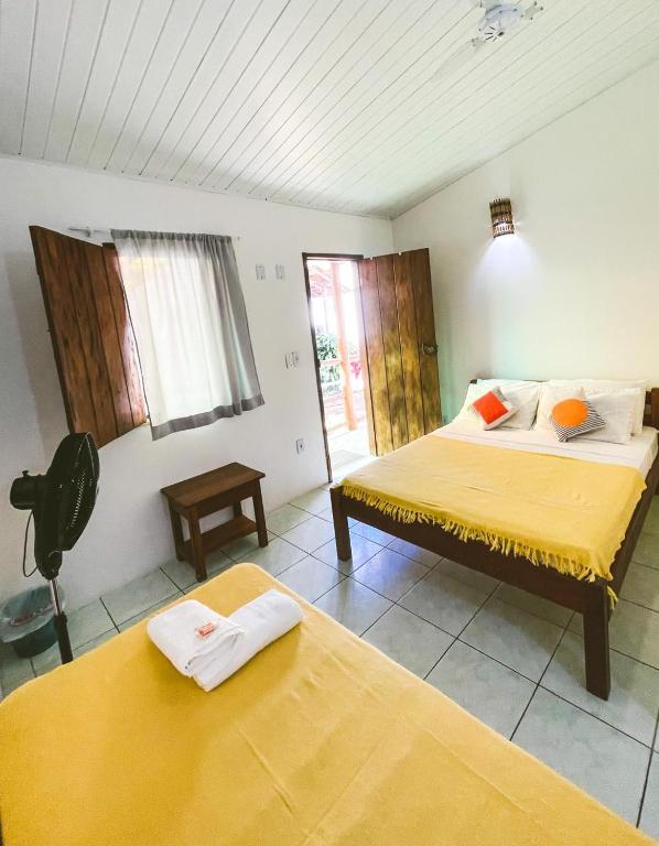 Cama ou camas em um quarto em Buddy's Hostel Itacaré
