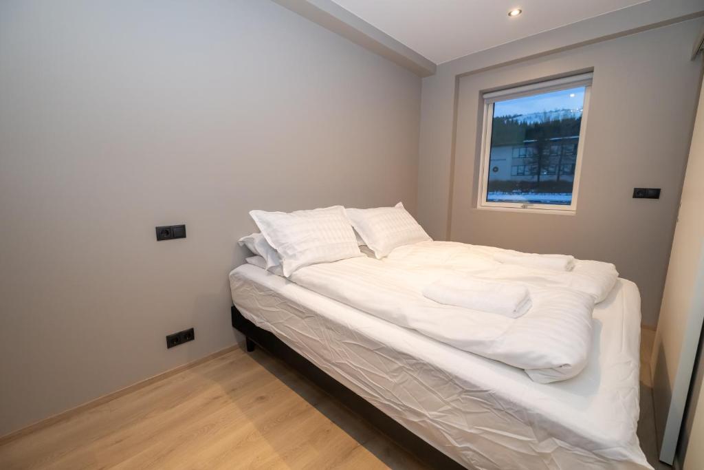 Postel nebo postele na pokoji v ubytování Storigardur Premium Apartments