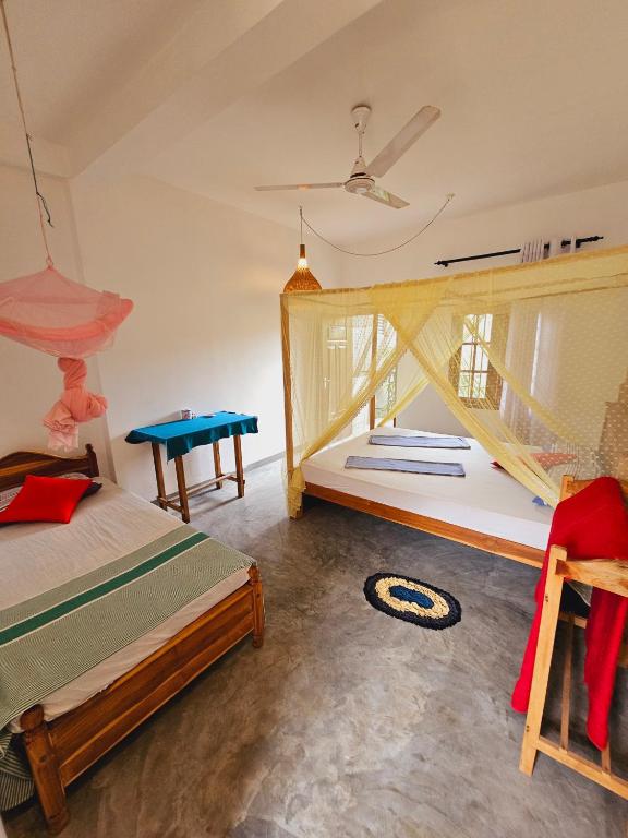 Postel nebo postele na pokoji v ubytování Sun Rest Mirissa