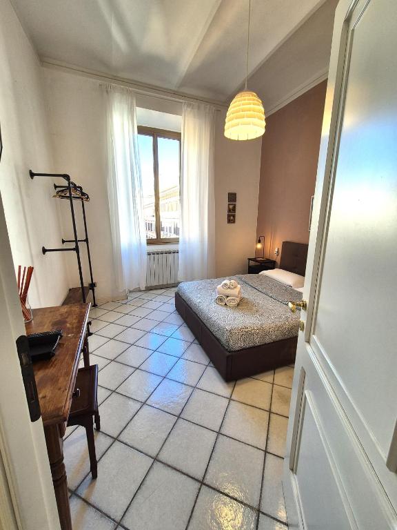 Posteľ alebo postele v izbe v ubytovaní Redseven Rome Apartments