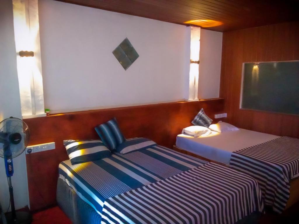 Postel nebo postele na pokoji v ubytování 4s Heaven