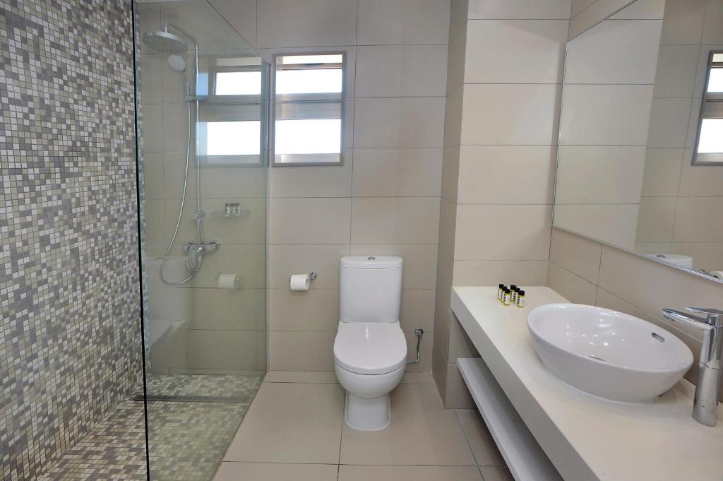 a bathroom with a toilet and a sink and a shower at Euronapa Hotel Apartments in Ayia Napa