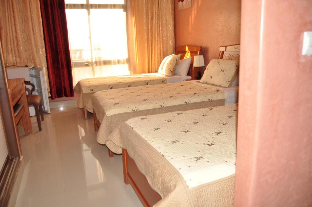 Voodi või voodid majutusasutuse Hôtel Atenas toas