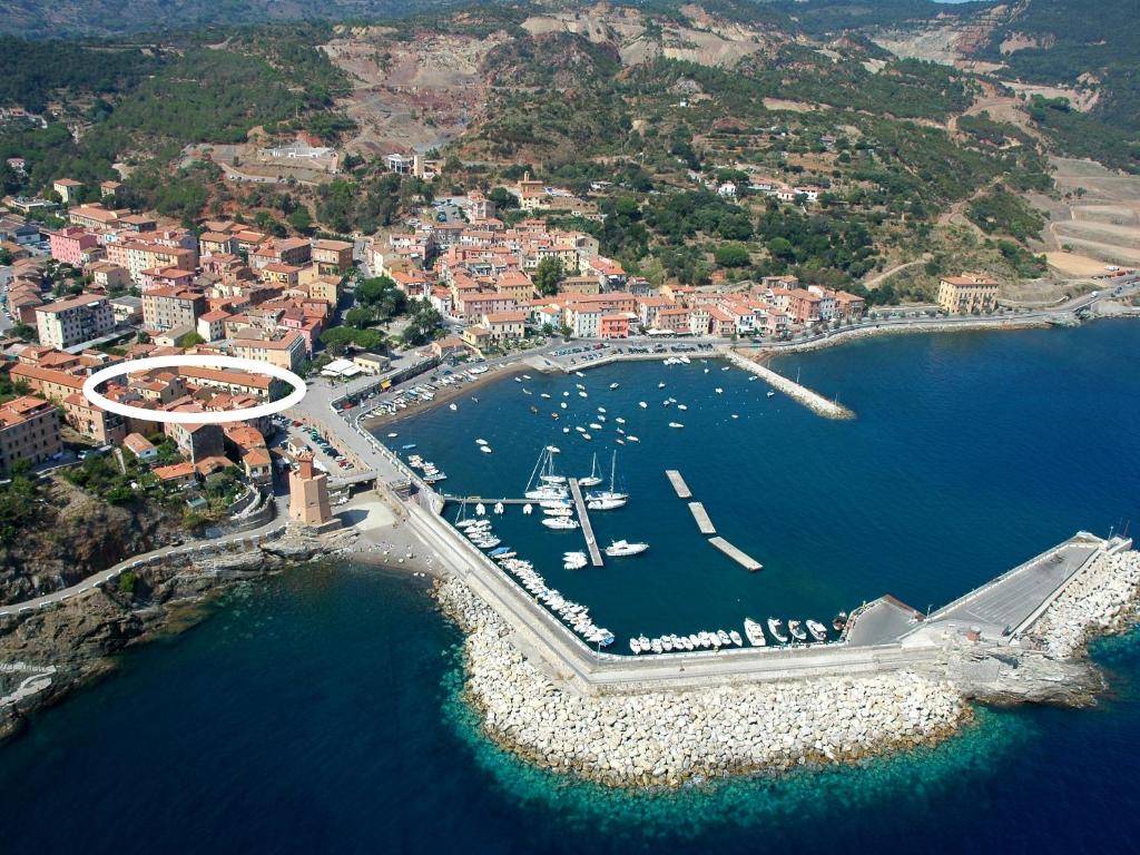 an aerial view of a harbor with boats in the water at Le Maree La Mansarda in Rio Marina