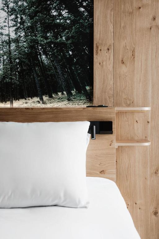 Postel nebo postele na pokoji v ubytování Chalet Hôtel Quartz