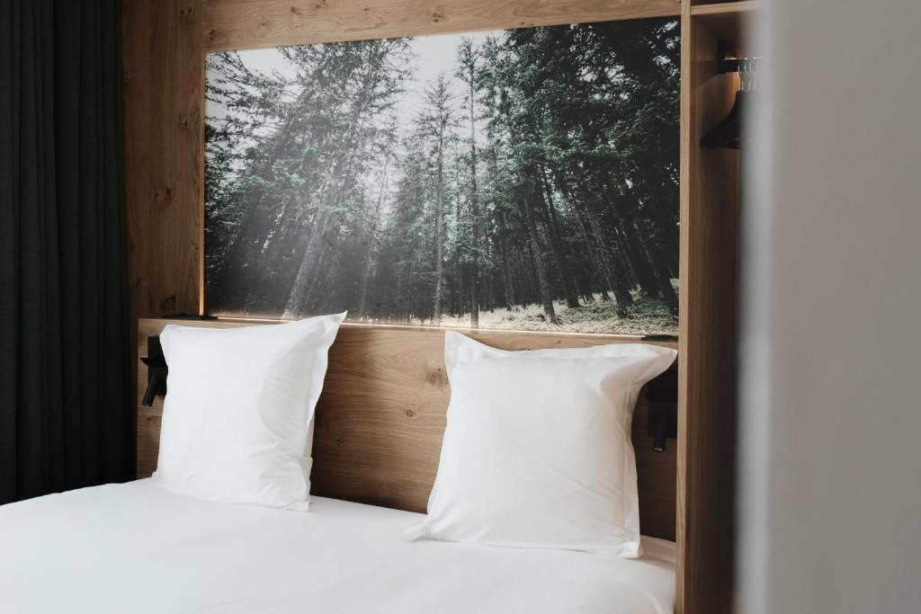 Postel nebo postele na pokoji v ubytování Chalet Hôtel Quartz