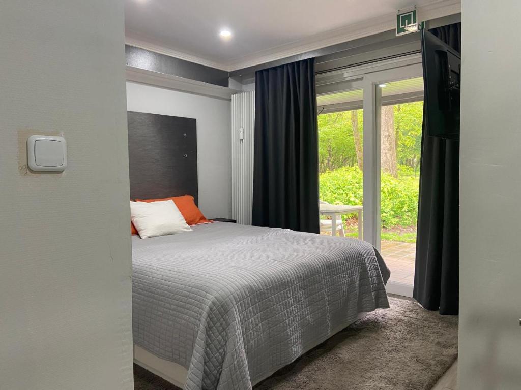 Postel nebo postele na pokoji v ubytování Vakantie Villa Hengelhoef