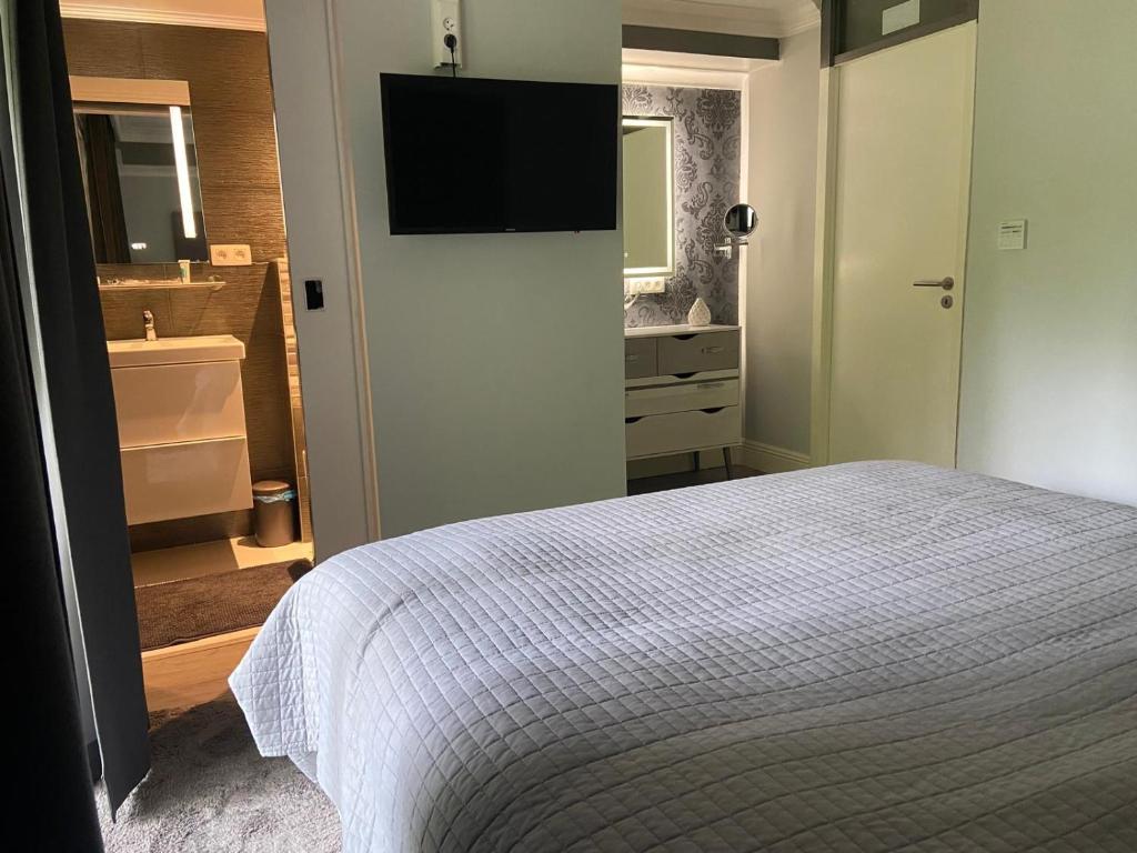 Postel nebo postele na pokoji v ubytování Vakantie Villa Hengelhoef