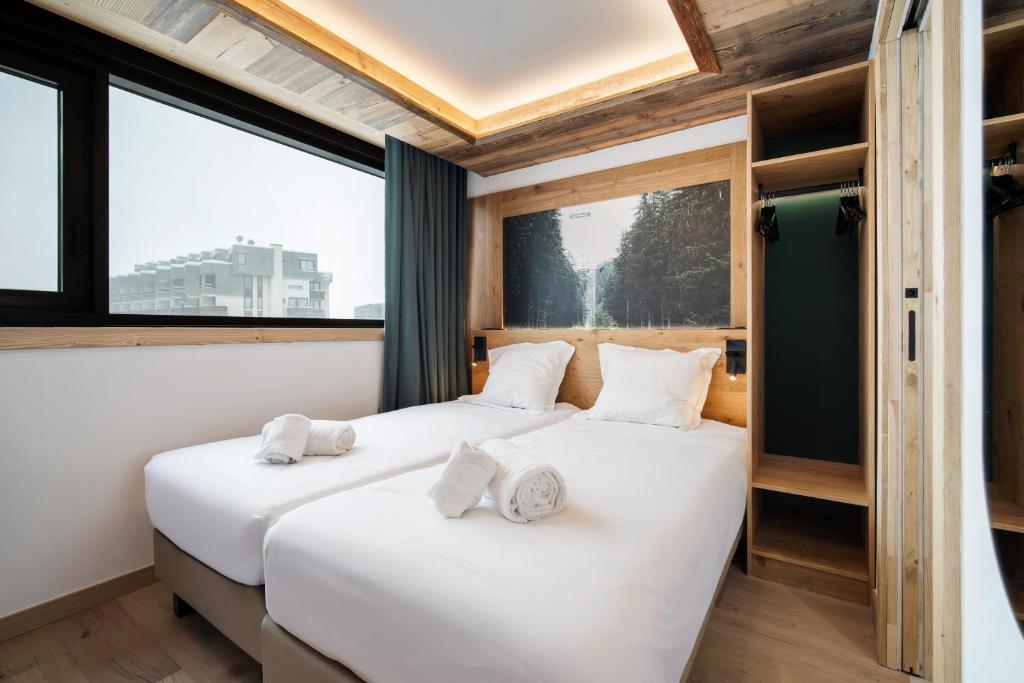 Postel nebo postele na pokoji v ubytování Chalet Hôtel Quartz