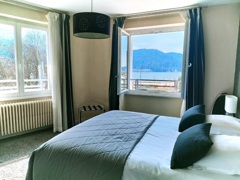Postel nebo postele na pokoji v ubytování Hôtel La Réserve