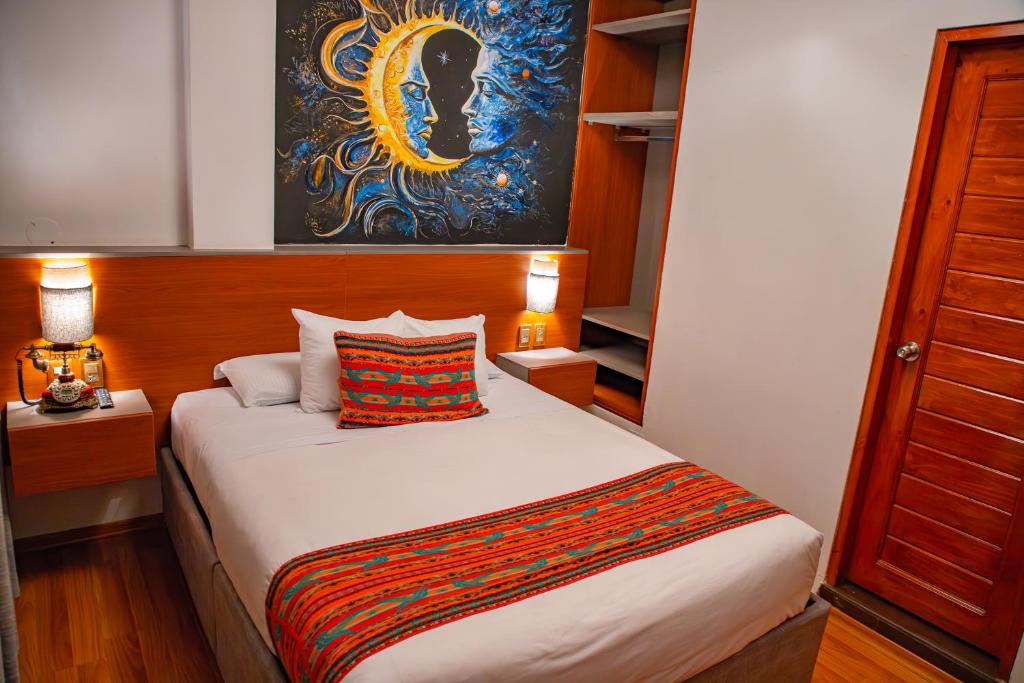 Postel nebo postele na pokoji v ubytování Ausangate Hotel Machupicchu
