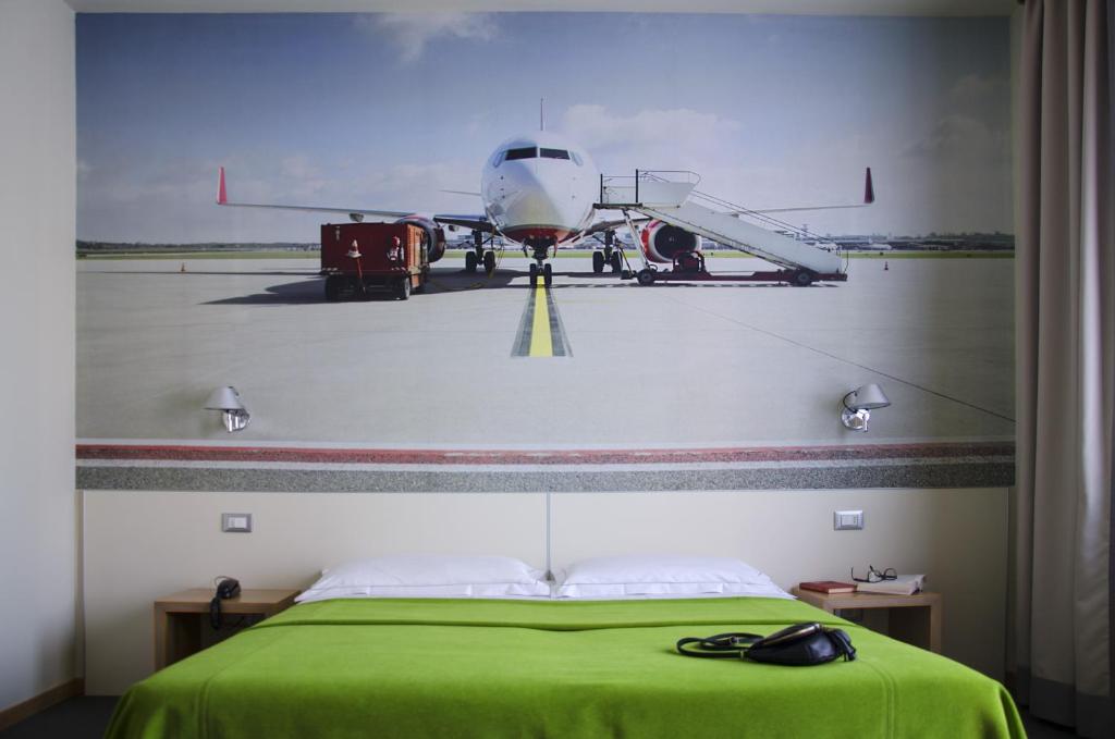 Postel nebo postele na pokoji v ubytování Key Hotel