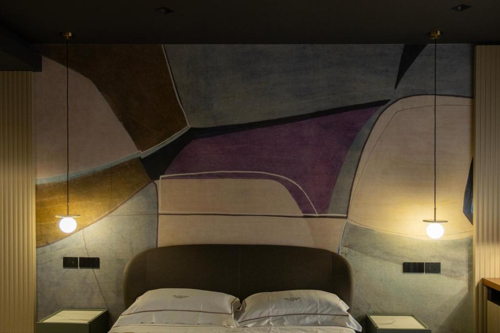 Postel nebo postele na pokoji v ubytování Villa Della Lupa Luxury Rooms