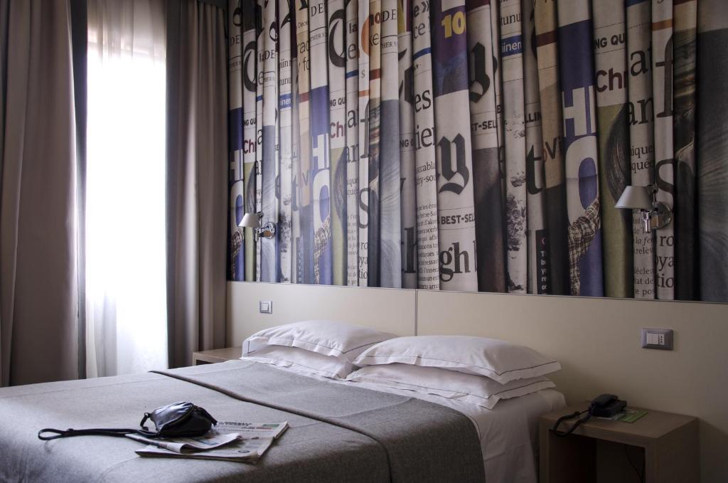 Postel nebo postele na pokoji v ubytování Key Hotel
