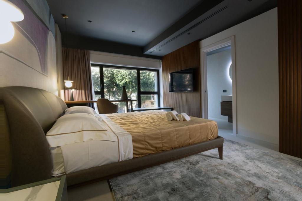 Postel nebo postele na pokoji v ubytování Villa Della Lupa Luxury Rooms