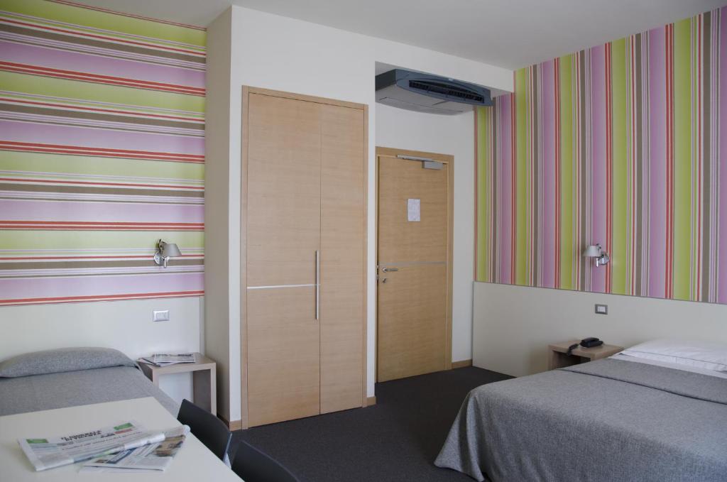 Postel nebo postele na pokoji v ubytování Key Hotel