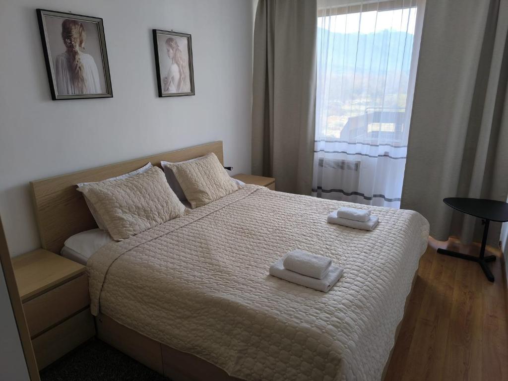 Postel nebo postele na pokoji v ubytování VIP Apartment Belvedere Club