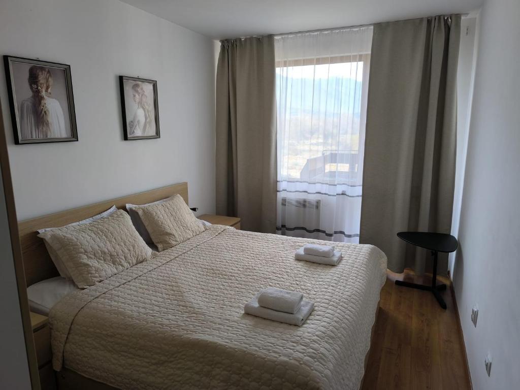 Postel nebo postele na pokoji v ubytování VIP Apartment Belvedere Club