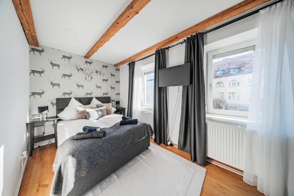 Postel nebo postele na pokoji v ubytování Innsbruck City Chalet