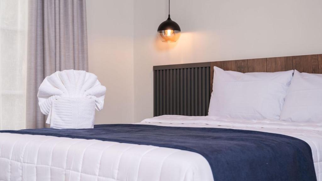 Postel nebo postele na pokoji v ubytování Hotel Boutique Nueva Valladolid