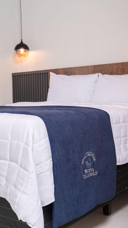 Postel nebo postele na pokoji v ubytování Hotel Boutique Nueva Valladolid