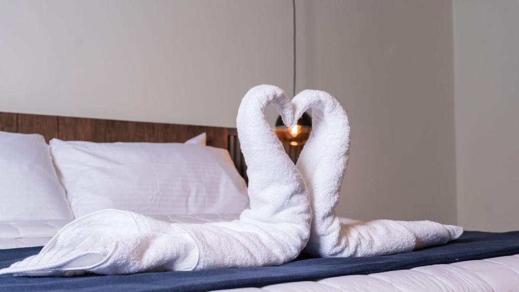 Postel nebo postele na pokoji v ubytování Hotel Boutique Nueva Valladolid