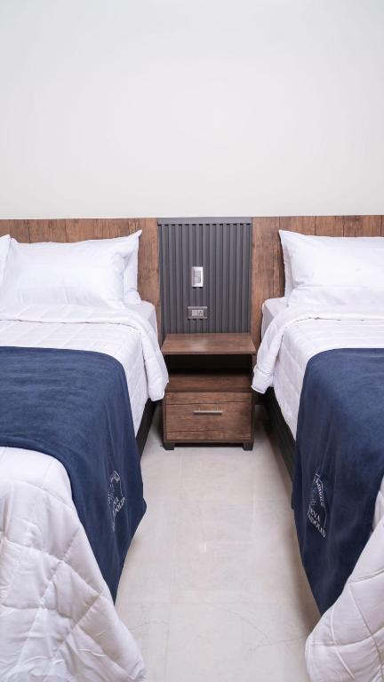 Postel nebo postele na pokoji v ubytování Hotel Boutique Nueva Valladolid