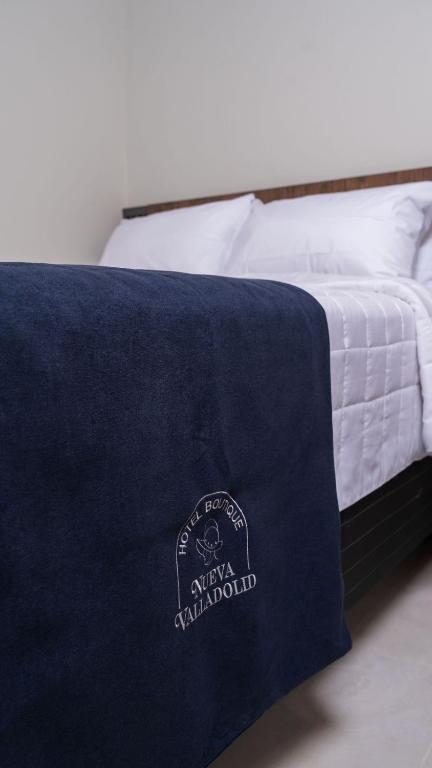 Postel nebo postele na pokoji v ubytování Hotel Boutique Nueva Valladolid