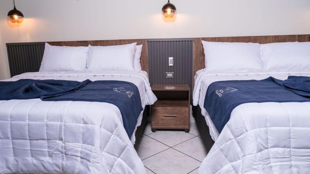 Postel nebo postele na pokoji v ubytování Hotel Boutique Nueva Valladolid