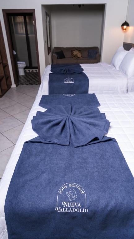 Postel nebo postele na pokoji v ubytování Hotel Boutique Nueva Valladolid