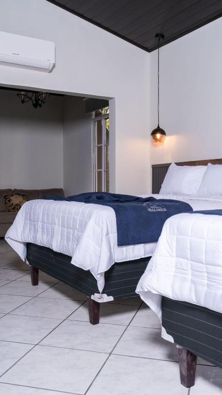 Postel nebo postele na pokoji v ubytování Hotel Boutique Nueva Valladolid