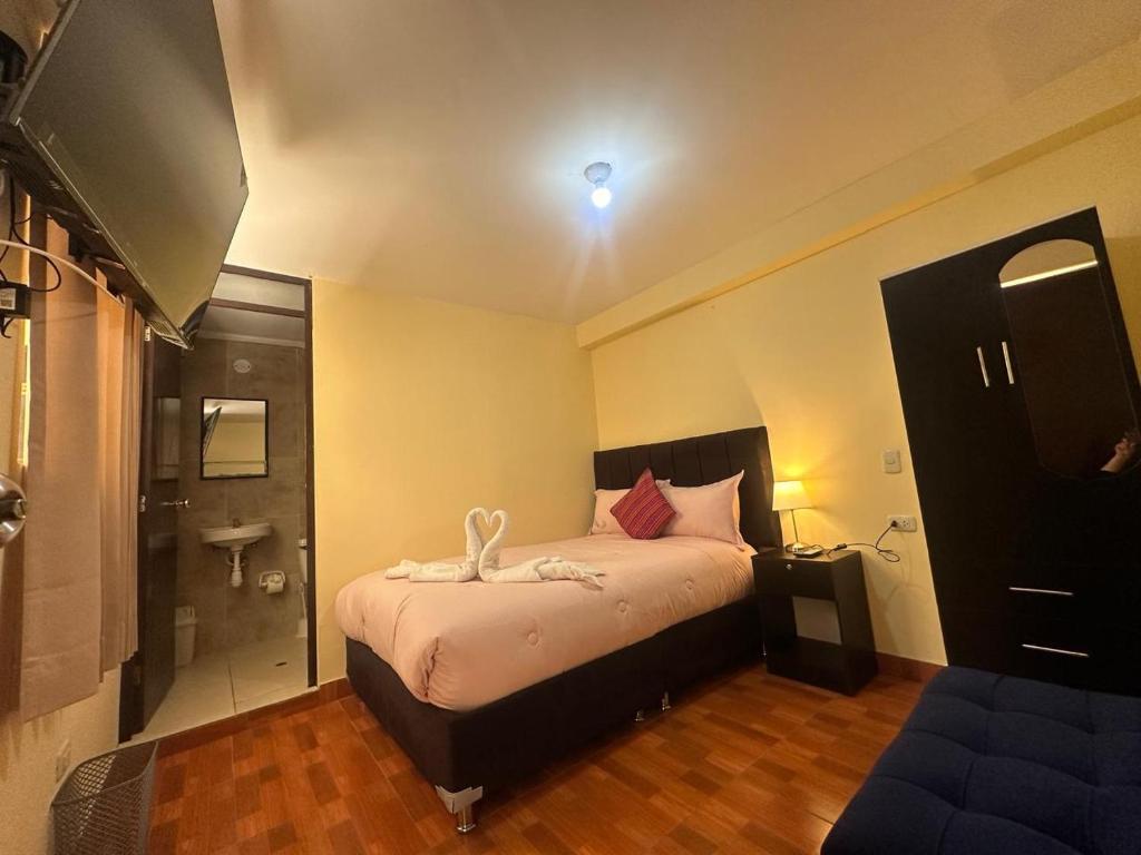 Postel nebo postele na pokoji v ubytování Valicha Casa Hotel