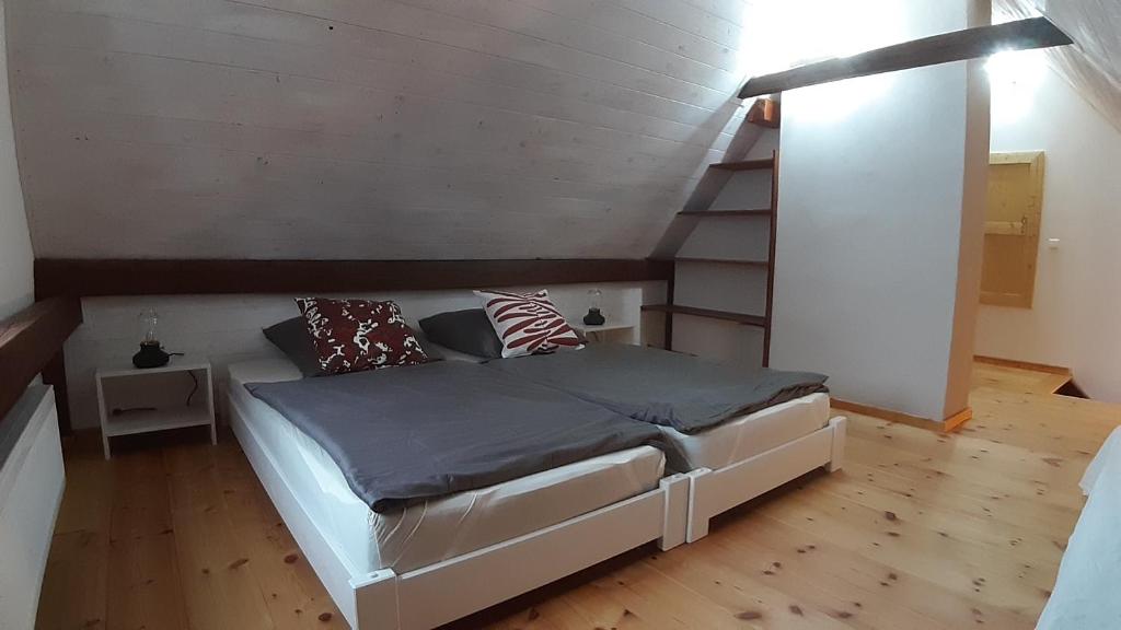 a bedroom with a bed and a staircase at Fewo Arnsdorf in Arnsdorf