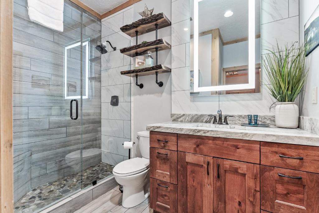 a bathroom with a shower and a toilet and a sink at Deer Valley Luxury 3 BR, Private Master Suite, Private Hot Tub, Amazing Views in Park City