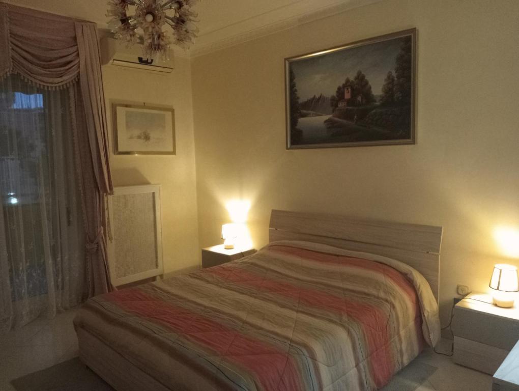 Postel nebo postele na pokoji v ubytování Appartamento confortevole per famiglie