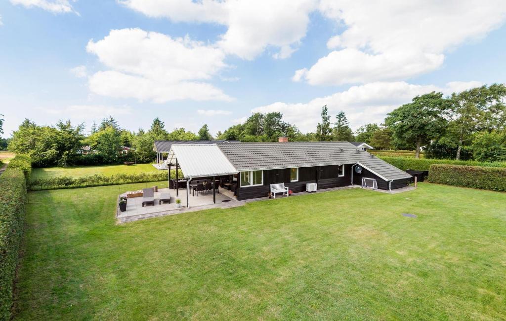 a home with a large yard with a house at Nice Home In Tarm With Kitchen in Hemmet