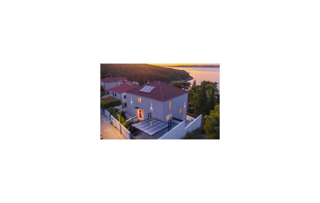 an aerial view of a house with a beach at Luxurious Apartment In Postira in Postira