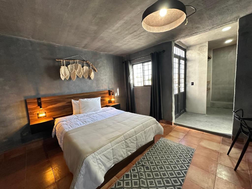 Postel nebo postele na pokoji v ubytování Hotel Damiana Boutique